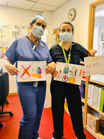 Staff holding thank you pictures